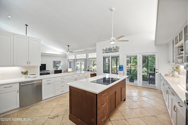 kitchen with dishwasher, lofted ceiling, black electric stovetop, ceiling fan, and backsplash