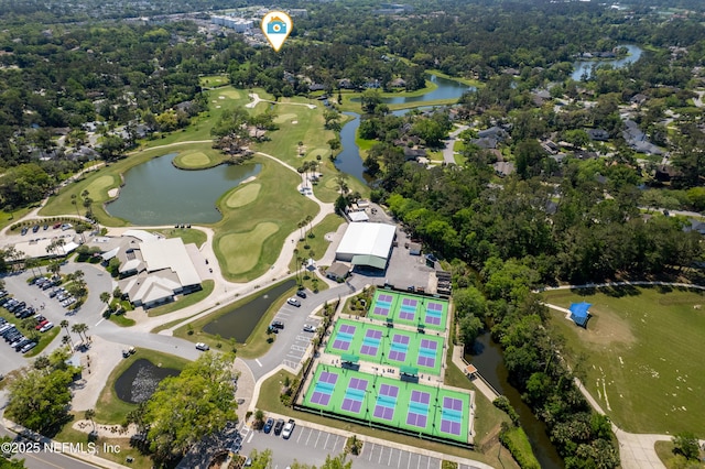 view of property location with a large body of water and a golf course