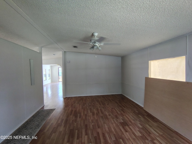 217 Pineway W Ave, Satsuma, FL 32189 - empty room featuring a ceiling fan, dark wood finished floors, and a textured ceiling