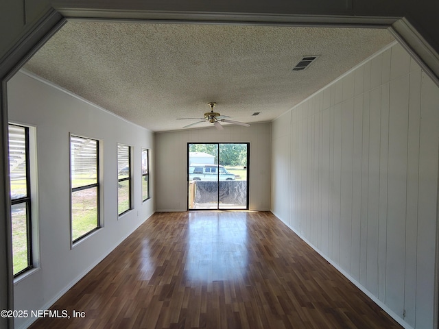 217 Pineway W Ave, Satsuma, FL 32189 - unfurnished room with dark wood finished floors, crown molding, a ceiling fan, a textured ceiling, and baseboards