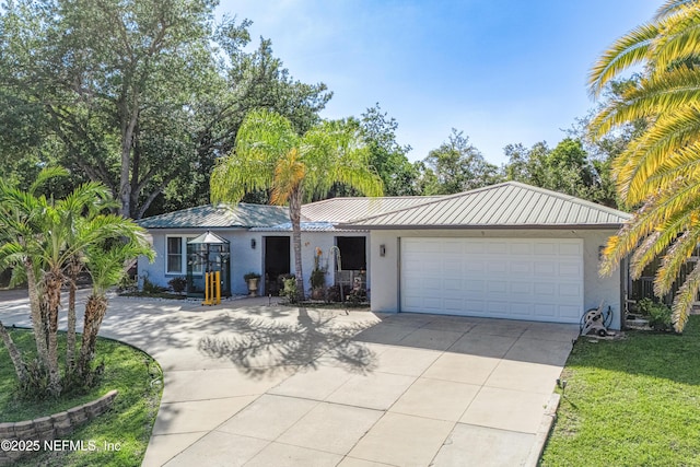 9 Blare Dr, Palm Coast, FL 32137 - ranch-style home with stucco siding, concrete driveway, a garage, and metal roof
