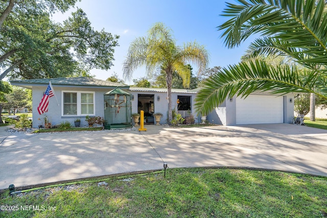 9 Blare Dr, Palm Coast, FL 32137 - ranch-style home featuring concrete driveway, stucco siding, and a garage