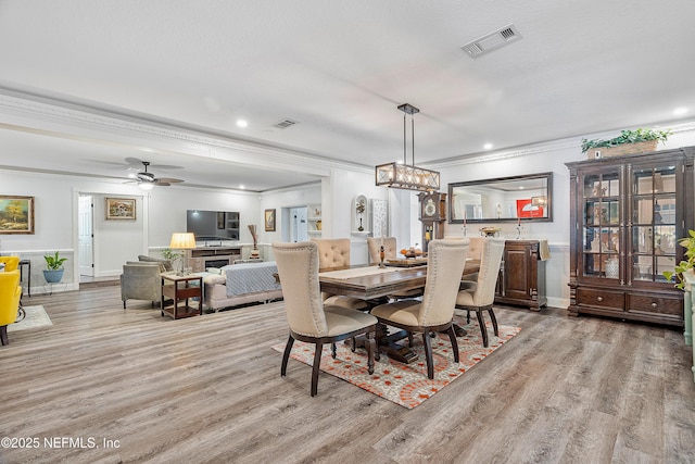 9 Blare Dr, Palm Coast, FL 32137 - dining space featuring visible vents, light wood-type flooring, and crown molding
