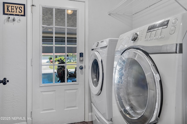 9 Blare Dr, Palm Coast, FL 32137 - washroom with a textured wall, washing machine and dryer, and laundry area