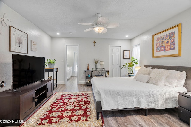 9 Blare Dr, Palm Coast, FL 32137 - bedroom with baseboards, ceiling fan, a textured ceiling, recessed lighting, and wood finished floors