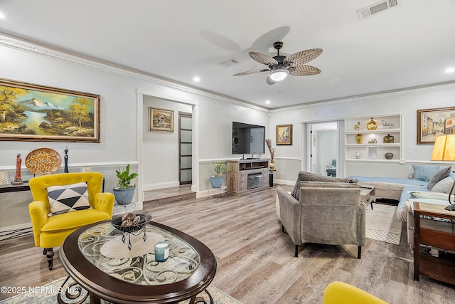 9 Blare Dr, Palm Coast, FL 32137 - living room with visible vents, ceiling fan, ornamental molding, and wood finished floors