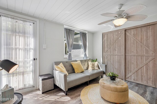 9 Blare Dr, Palm Coast, FL 32137 - living area with wood finished floors, a ceiling fan, and wooden ceiling