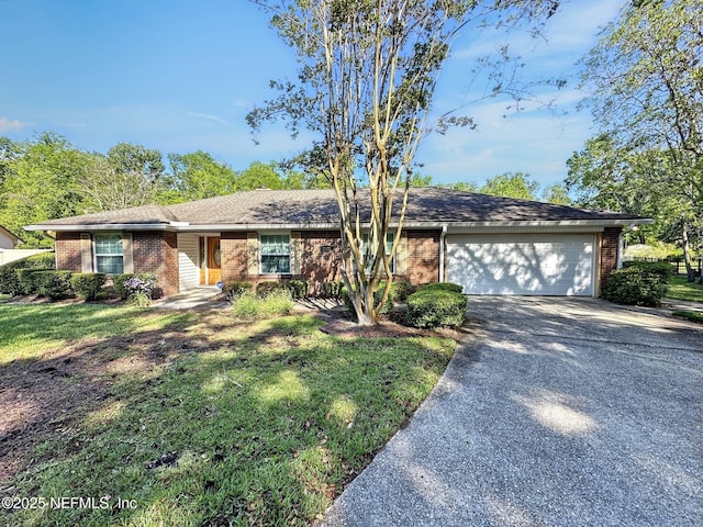 ranch-style home with driveway, a front lawn, brick siding, and a garage