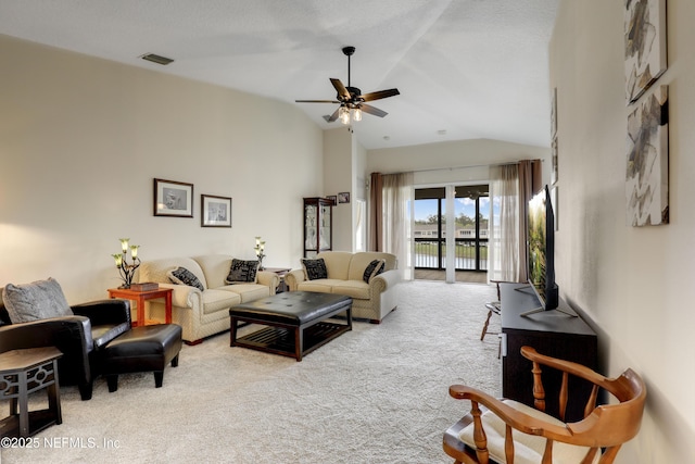 11929 Surfbird Cir Unit 12F, Jacksonville, FL 32256 - carpeted living area featuring high vaulted ceiling, visible vents, and ceiling fan