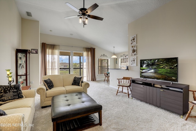 11929 Surfbird Cir Unit 12F, Jacksonville, FL 32256 - carpeted living area with visible vents, ceiling fan, baseboards, and lofted ceiling