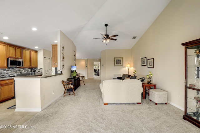11929 Surfbird Cir Unit 12F, Jacksonville, FL 32256 - living area with baseboards, visible vents, light colored carpet, and a ceiling fan