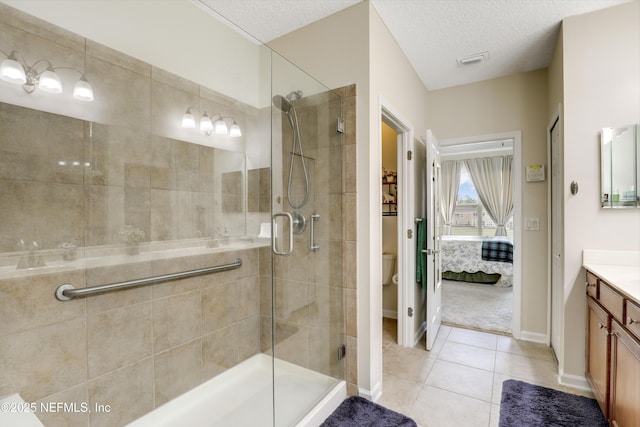 11929 Surfbird Cir Unit 12F, Jacksonville, FL 32256 - full bathroom featuring toilet, a stall shower, vanity, and tile patterned floors