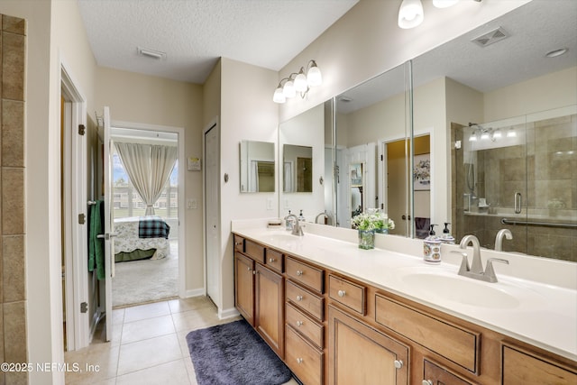 11929 Surfbird Cir Unit 12F, Jacksonville, FL 32256 - full bath with a sink, visible vents, and a textured ceiling