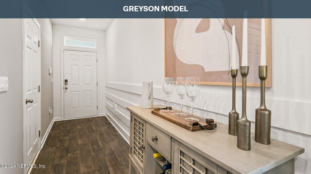 9926 Wyndbrook Ter, Jacksonville, FL 32210 - doorway to outside featuring dark wood-style flooring and a dry bar