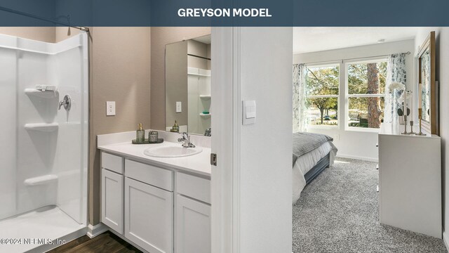 9926 Wyndbrook Ter, Jacksonville, FL 32210 - bathroom featuring a stall shower and vanity