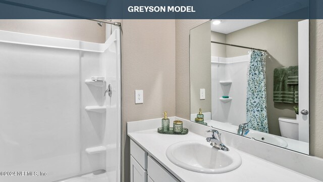 9926 Wyndbrook Ter, Jacksonville, FL 32210 - bathroom featuring toilet, vanity, and a shower with shower curtain