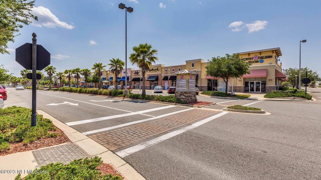 9926 Wyndbrook Ter, Jacksonville, FL 32210 - view of street featuring street lighting, sidewalks, traffic signs, curbs, and a residential view