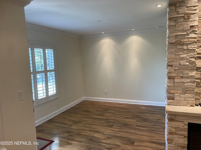 929 Seashell Ln, Ponte Vedra Beach, FL 32082 - spare room with wood finished floors, baseboards, a fireplace, and crown molding