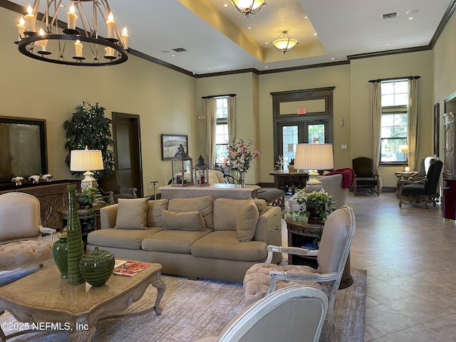 929 Seashell Ln, Ponte Vedra Beach, FL 32082 - living area with visible vents, a chandelier, ornamental molding, and a healthy amount of sunlight