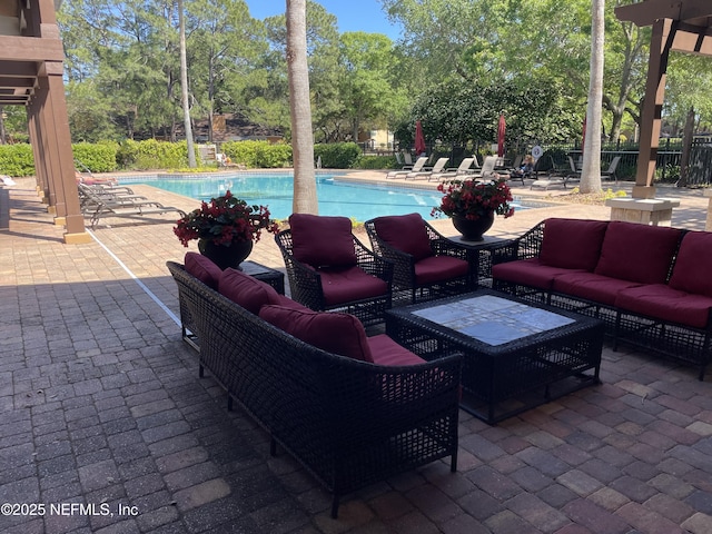929 Seashell Ln, Ponte Vedra Beach, FL 32082 - community pool with a patio, fence, and an outdoor living space