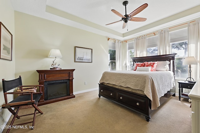 708 El Vergel Ln, Saint Augustine, FL 32080 - bedroom featuring ceiling fan, baseboards, a glass covered fireplace, and carpet