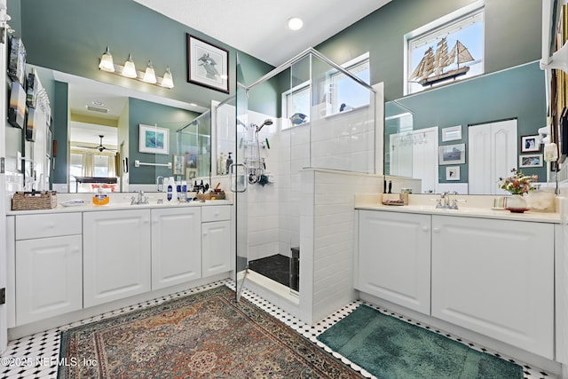 708 El Vergel Ln, Saint Augustine, FL 32080 - full bath with a stall shower, two vanities, ceiling fan, and a sink