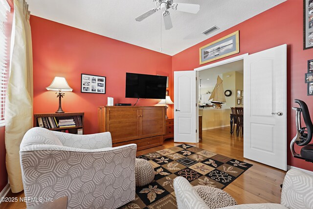 708 El Vergel Ln, Saint Augustine, FL 32080 - living area with wood finished floors, baseboards, a ceiling fan, and visible vents