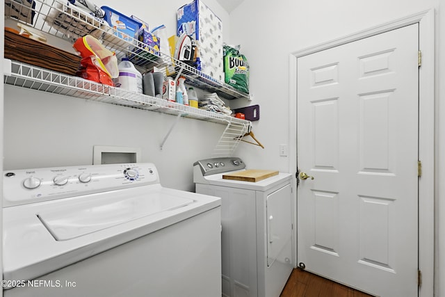 708 El Vergel Ln, Saint Augustine, FL 32080 - laundry room with dark wood-style flooring, laundry area, and washing machine and clothes dryer