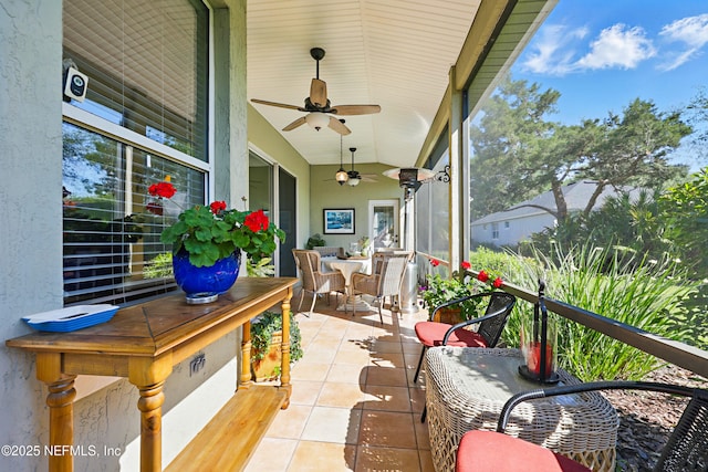 708 El Vergel Ln, Saint Augustine, FL 32080 - sunroom / solarium with tile patterned floors, ceiling fan, outdoor dining area, and vaulted ceiling