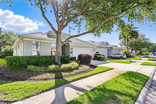 708 El Vergel Ln, Saint Augustine, FL 32080 - view of front of home with an attached garage, driveway, and stucco siding