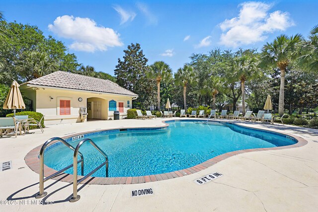 708 El Vergel Ln, Saint Augustine, FL 32080 - community pool featuring a patio area and fence