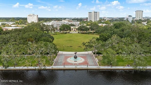 drone / aerial view with a city view and a water view