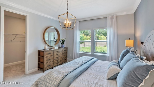 265 Dogleg Run, Saint Johns, FL 32259 - bedroom with baseboards, a chandelier, crown molding, carpet floors, and a walk in closet