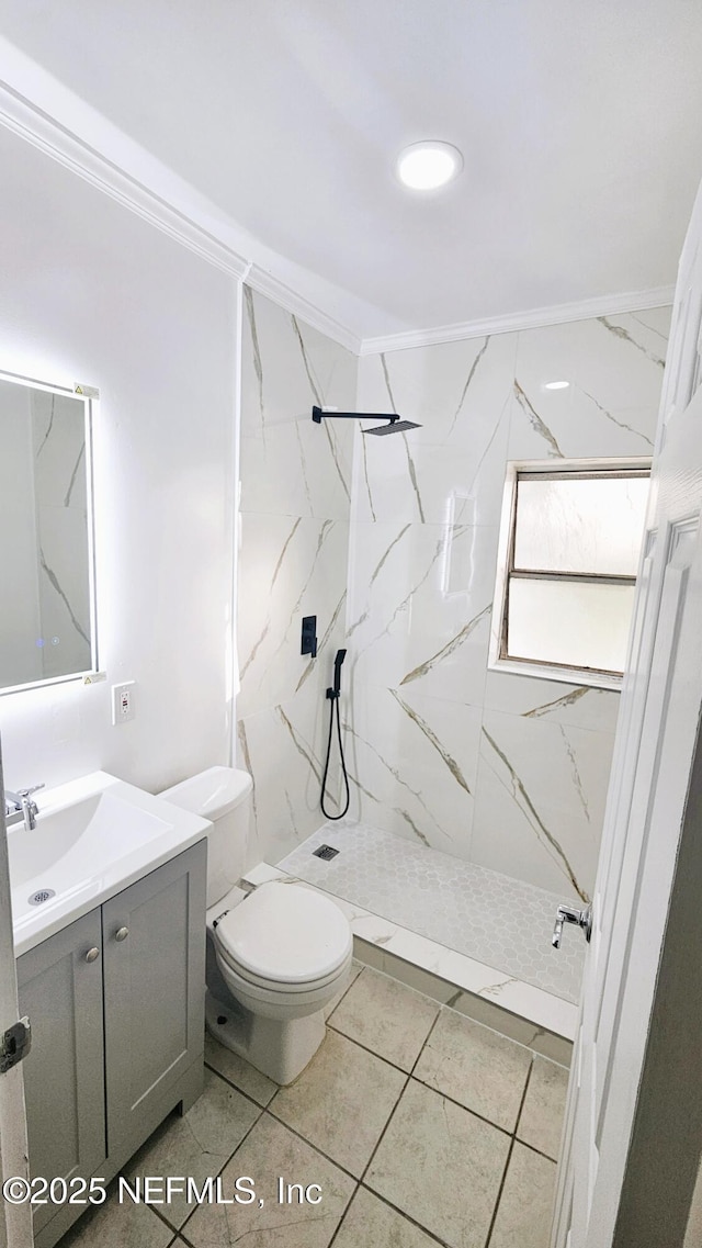 4916 Dundee Rd, Jacksonville, FL 32210 - bathroom featuring toilet, vanity, crown molding, and a marble finish shower