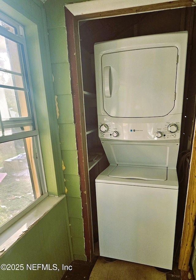 4916 Dundee Rd, Jacksonville, FL 32210 - laundry room with stacked washer / dryer and laundry area