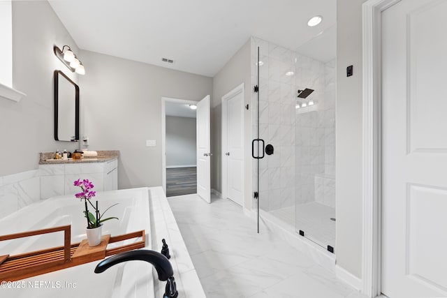 full bath featuring a bathtub, marble finish floor, baseboards, visible vents, and a stall shower