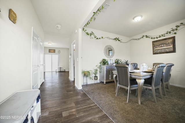 dining room with baseboards, dark wood finished floors, and visible vents