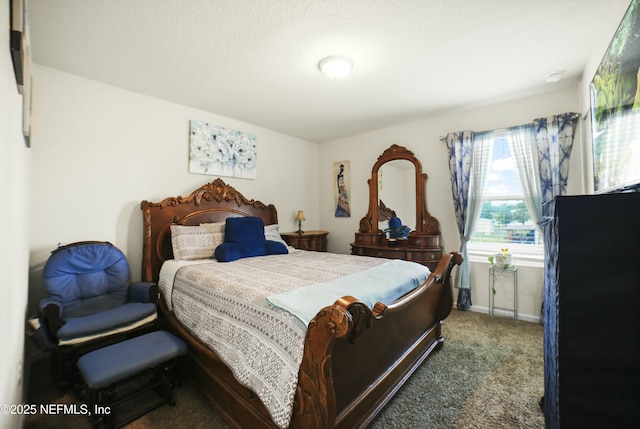 carpeted bedroom featuring baseboards