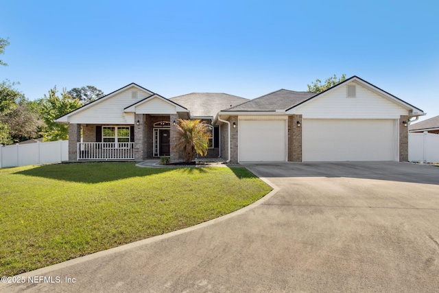 11975 Smith Pointe Ct, Jacksonville, FL 32218 - single story home with a front yard, driveway, fence, and a garage