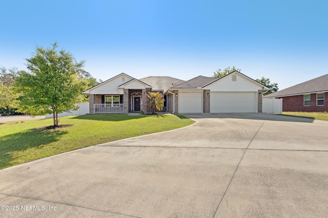 11975 Smith Pointe Ct, Jacksonville, FL 32218 - ranch-style home featuring covered porch, a front yard, brick siding, a garage, and driveway
