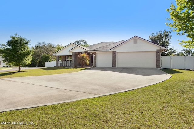 11975 Smith Pointe Ct, Jacksonville, FL 32218 - single story home with concrete driveway, a front yard, brick siding, and an attached garage