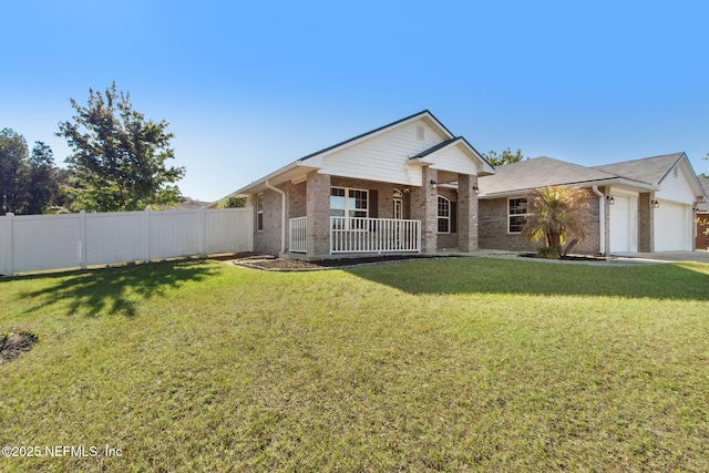 11975 Smith Pointe Ct, Jacksonville, FL 32218 - ranch-style house with a front yard, fence, brick siding, and covered porch