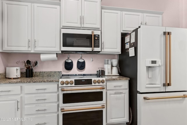 11975 Smith Pointe Ct, Jacksonville, FL 32218 - kitchen featuring white appliances and white cabinetry
