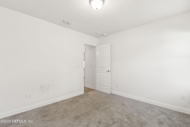 11975 Smith Pointe Ct, Jacksonville, FL 32218 - carpeted spare room with visible vents, baseboards, and a textured ceiling