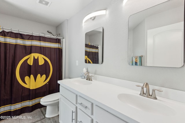11975 Smith Pointe Ct, Jacksonville, FL 32218 - full bath with toilet, double vanity, a sink, and visible vents