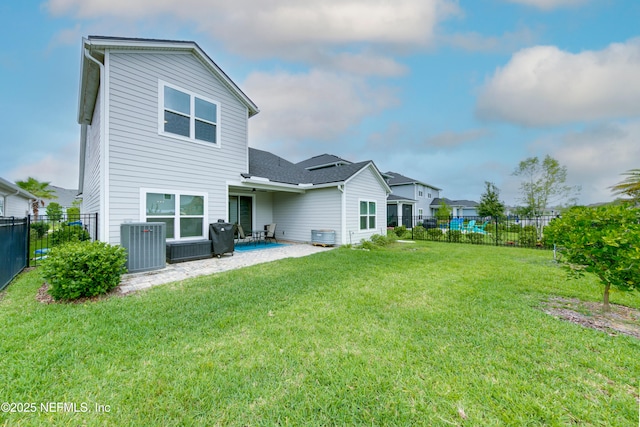 247 Beale Ave, Saint Augustine, FL 32092 - back of house with central AC unit, a fenced backyard, a patio, and a lawn