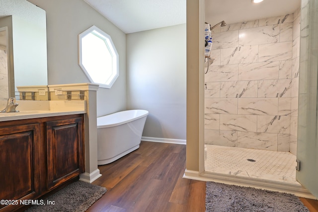 3038 Majestic Oaks Ln, Green Cove Springs, FL 32043 - full bath with a freestanding tub, vanity, wood finished floors, a stall shower, and baseboards