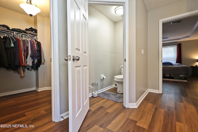 3038 Majestic Oaks Ln, Green Cove Springs, FL 32043 - bathroom featuring baseboards, a textured ceiling, toilet, visible vents, and wood finished floors
