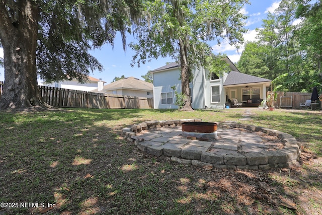 3038 Majestic Oaks Ln, Green Cove Springs, FL 32043 - view of yard featuring a patio area, an outdoor fire pit, a fenced backyard, and a ceiling fan