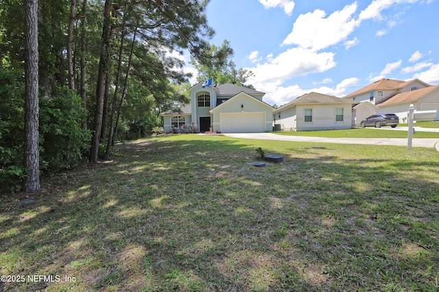 3038 Majestic Oaks Ln, Green Cove Springs, FL 32043 - view of front facade featuring a garage, a front yard, and concrete driveway